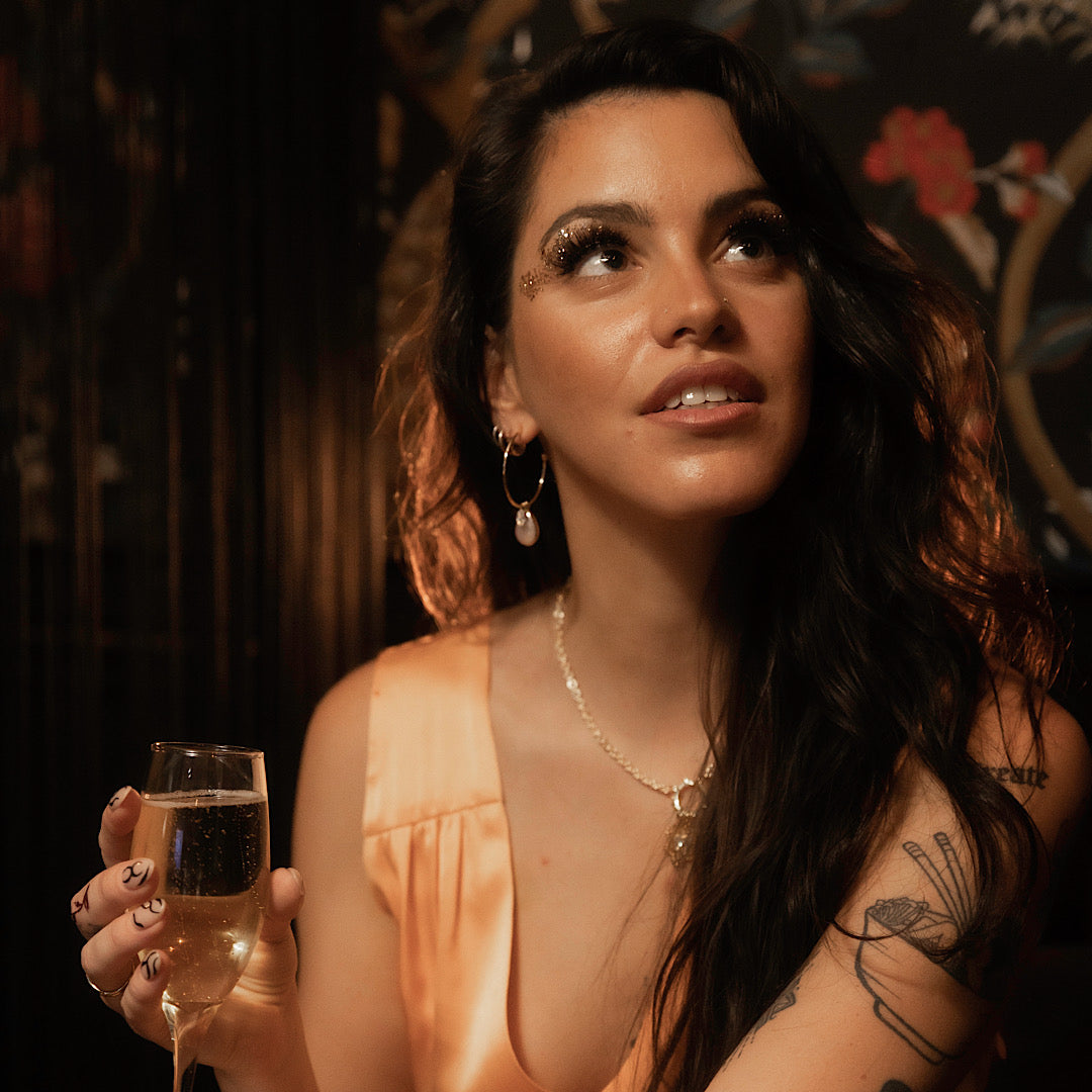 Gold-filled large thin hoop earrings with marquise stone charm and teardrop pearl charm."